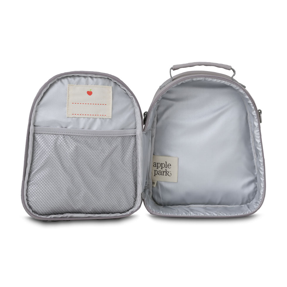 Open gray travel bag with 'apple park' label on a white background