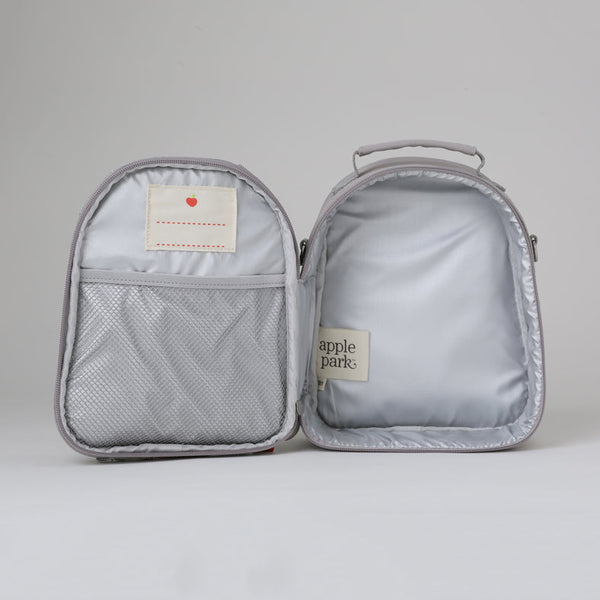 Gray travel bag with a visible brand label on a light gray background