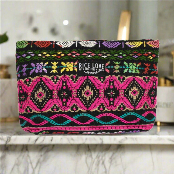 Upcycled jute makeup bag shown with beauty essentials