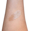 Beige makeup swatch on a person's arm against a white background