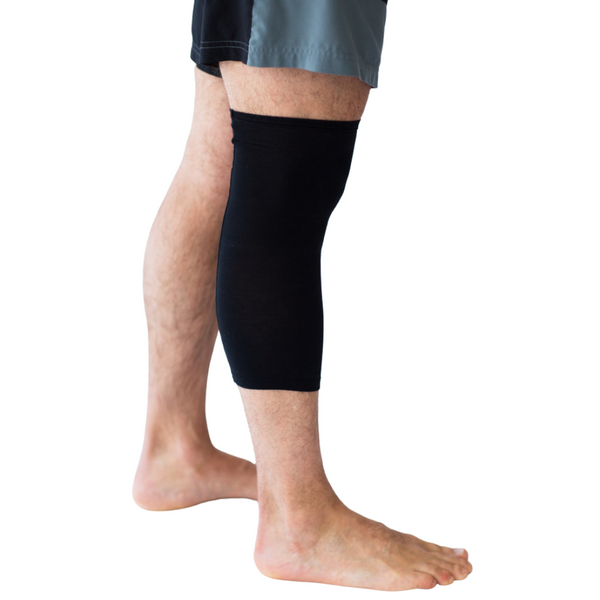 Man wearing Remedywear zinc oxide eczema bandage sleeve on his leg