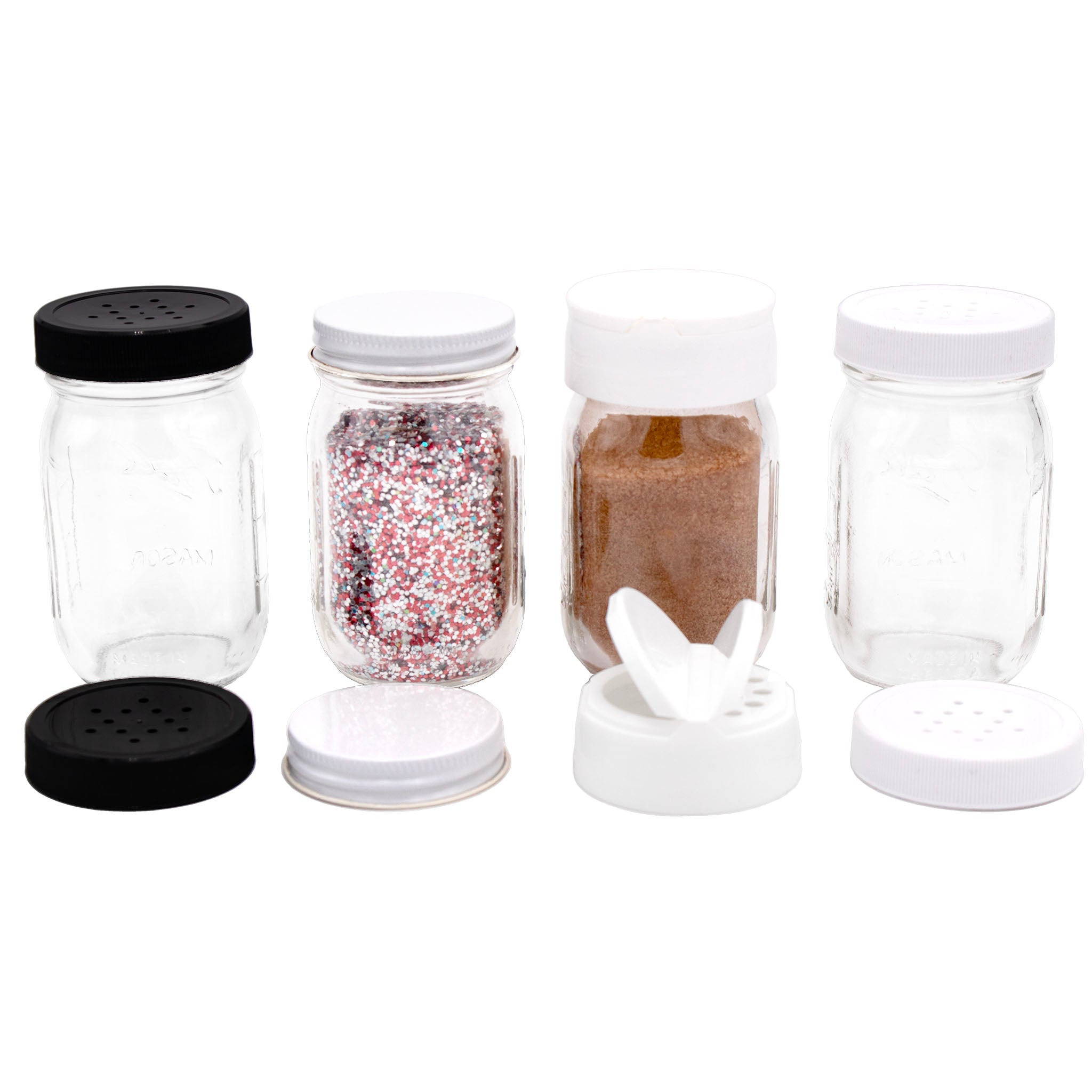 Set of glass spice jars with lids on a white background