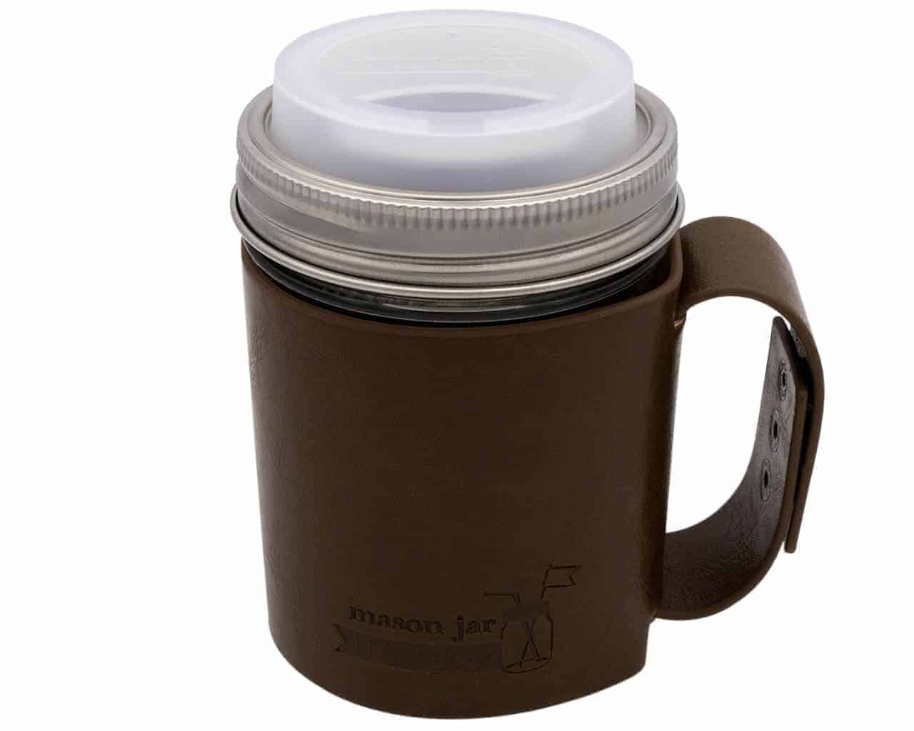 Brown leather mug with a white lid on a white background