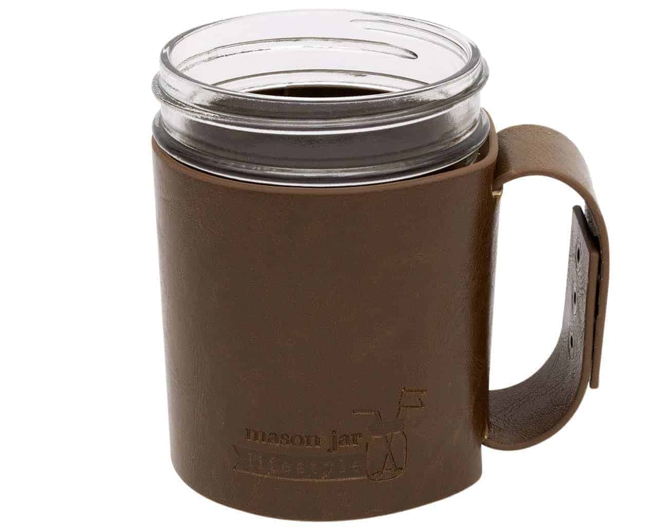 Brown leather mug with clear glass insert on a white background