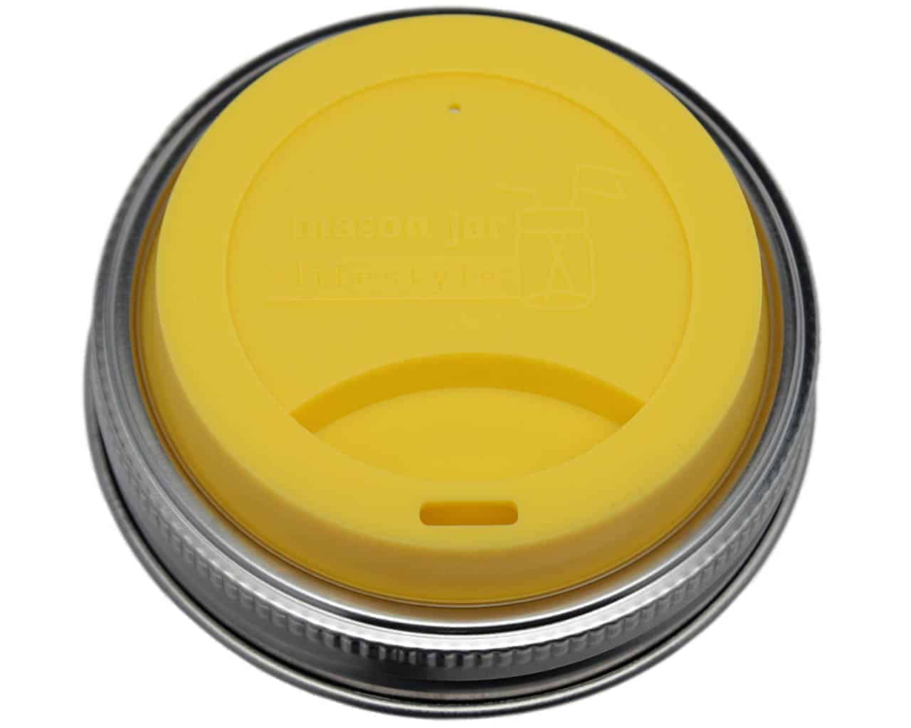 Yellow lid with black rim on a white background