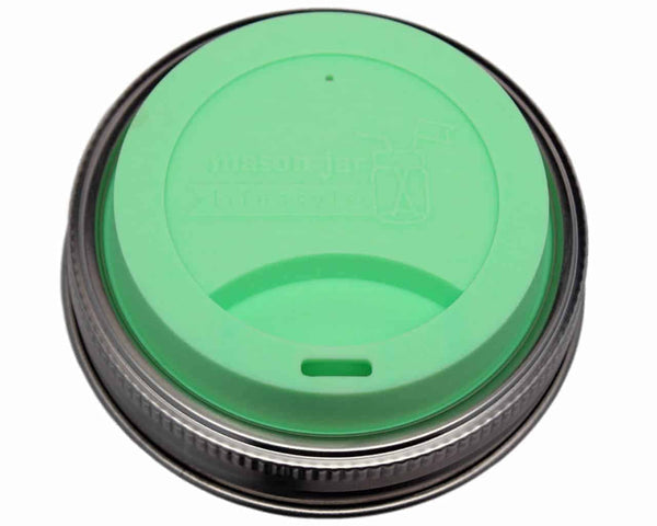 Green lid with black rim on a white background