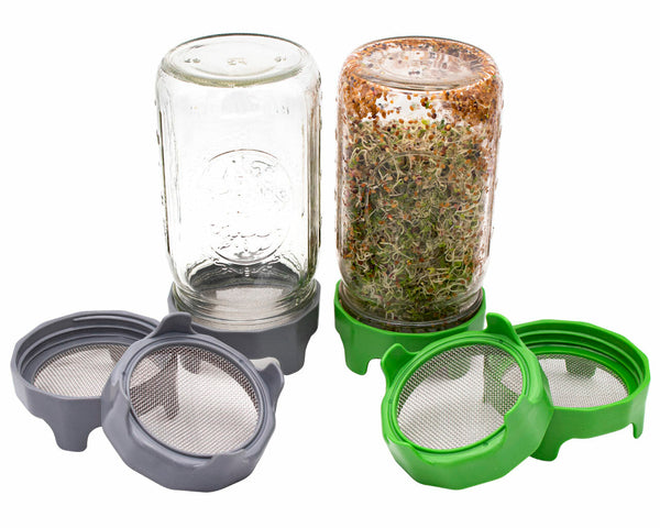 Set of glass jars with green and gray mesh lids on a white background