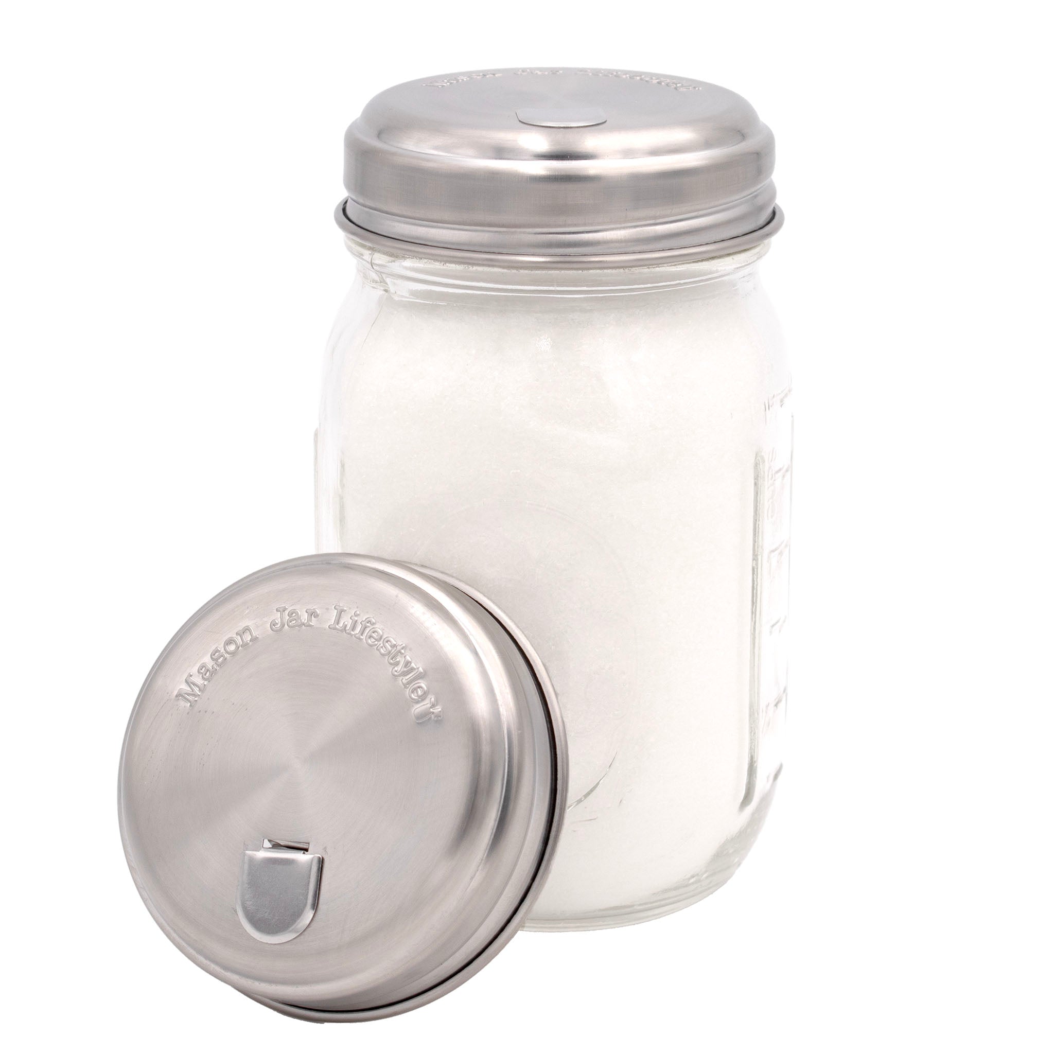 Clear glass jar with metal lid on a white background