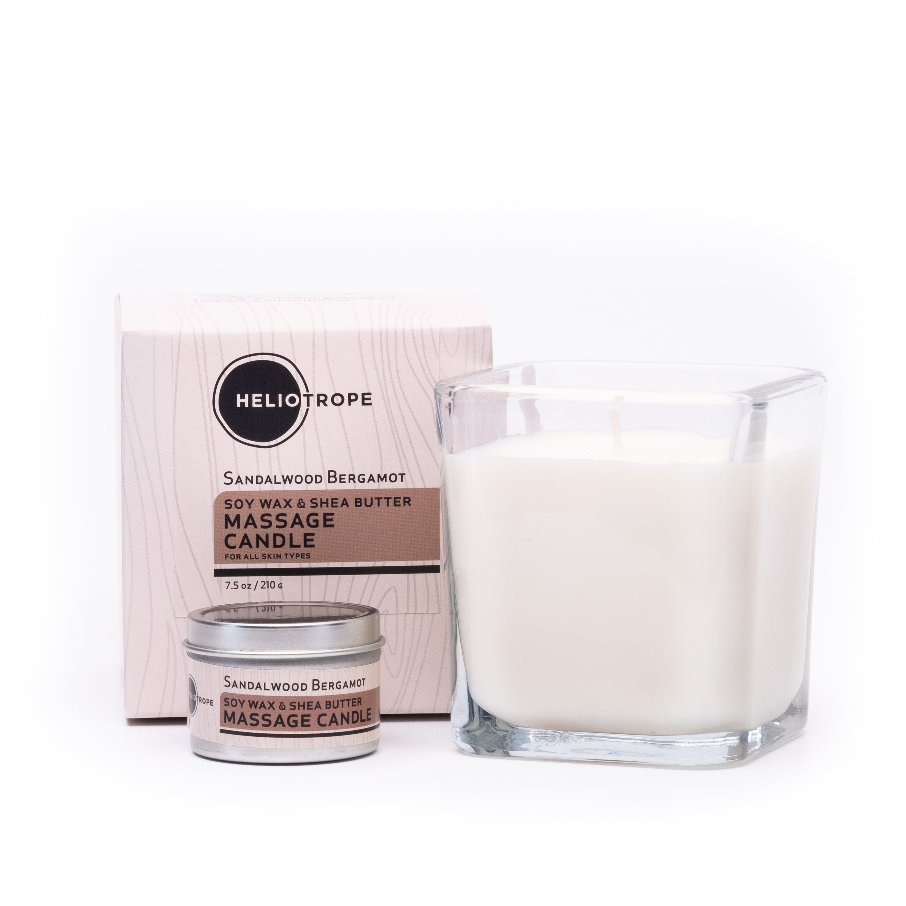 Heliotrope sandalwood bergamot massage candle with packaging on a white background
