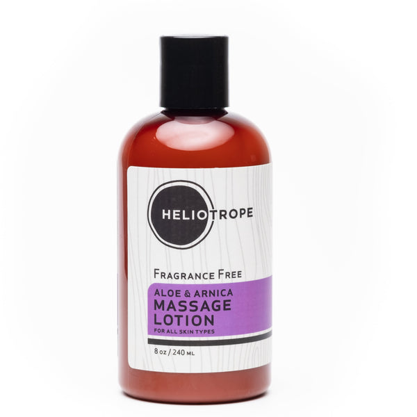 Heliotrope SF Aloe and Arnica deep tissue massage lotion in a glass pump bottle with 70% organic ingredients