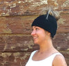 Messy bun alpaca hat laid flat showing open top ponytail design