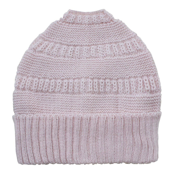 Knitted dog sweater in pink on a white background