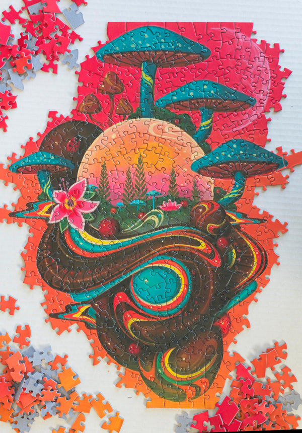 Microcosm jigsaw puzzle by Paul Lewin partially assembled on a table