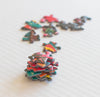 Loose pieces of the Microcosm 500-piece jigsaw puzzle by Paul Lewin