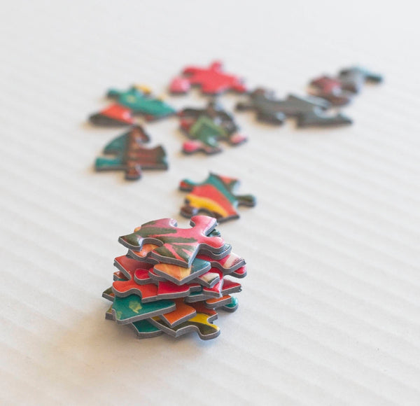 Loose pieces of the Microcosm 500-piece jigsaw puzzle by Paul Lewin