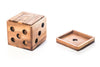 Wooden dice with multiple holes on a white background