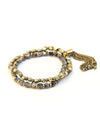 Dark charm bracelet stack with metal tassel detail, handmade fair trade bracelets from India