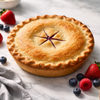 Andy Anand sugar-free mixed berry pie with a golden flaky crust, filled with whole strawberries, blueberries, and blackberries