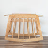 Wooden baby crib with a plain background