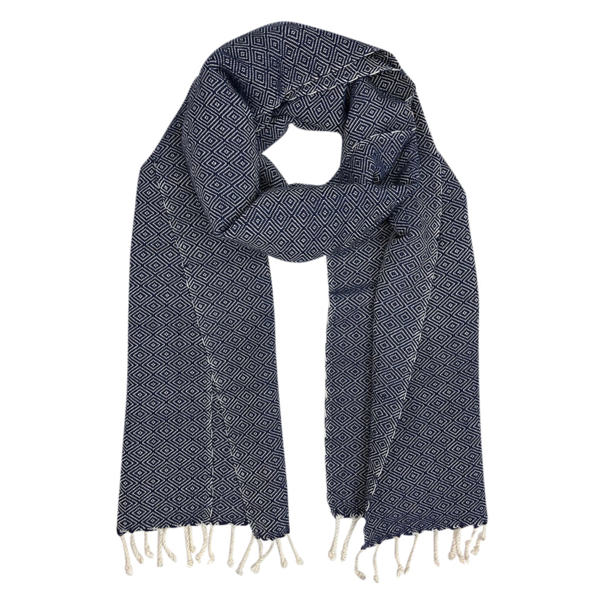 Navy blue patterned scarf with white tassels on a white background