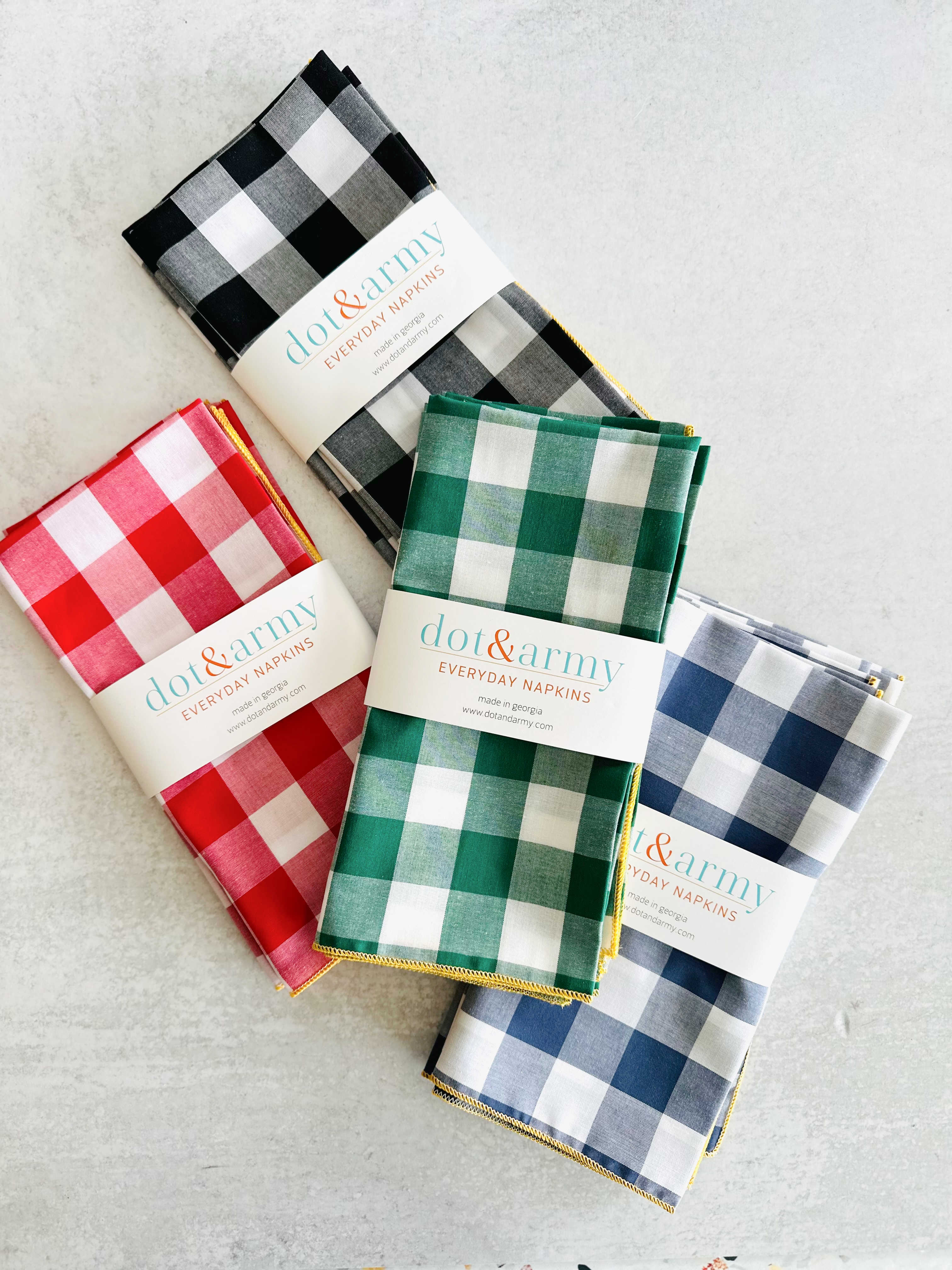 Close-up of gingham cloth napkin showing honey mustard border edge detail