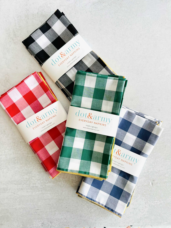 Close-up of gingham cloth napkin showing honey mustard border edge detail
