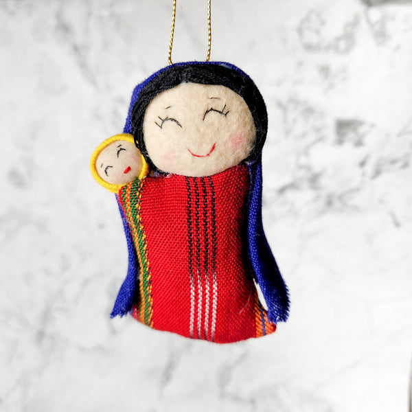 Add a touch of tradition and beauty to your Christmas tree with our handcrafted Mary and Jesus ornament. This fair trade piece is perfect for any home.