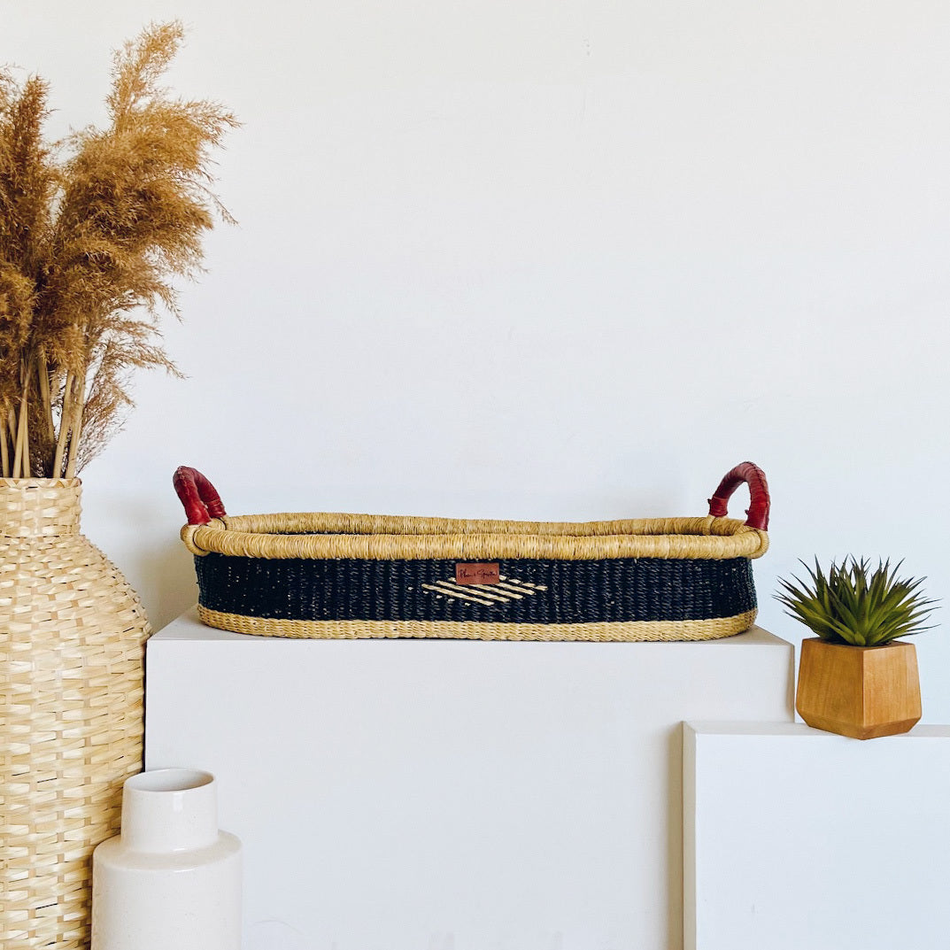 Nightfall Changing Basket by Plum and Sparrow handwoven from elephant grass in deep navy blue with included mattress