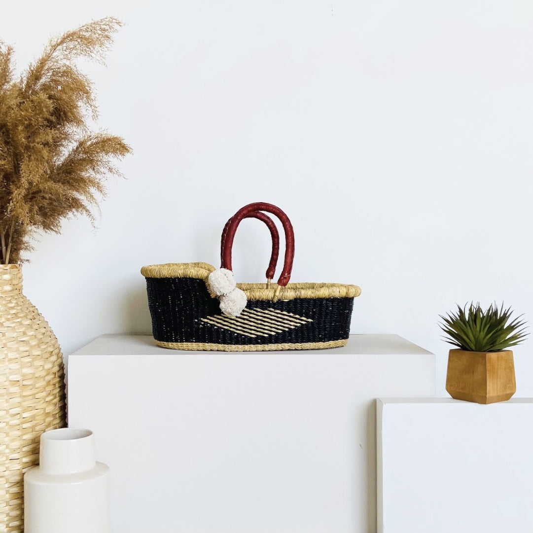 Nightfall Mini Moses Basket handwoven from elephant grass in deep navy blue, made in Ghana by Plum+Sparrow
