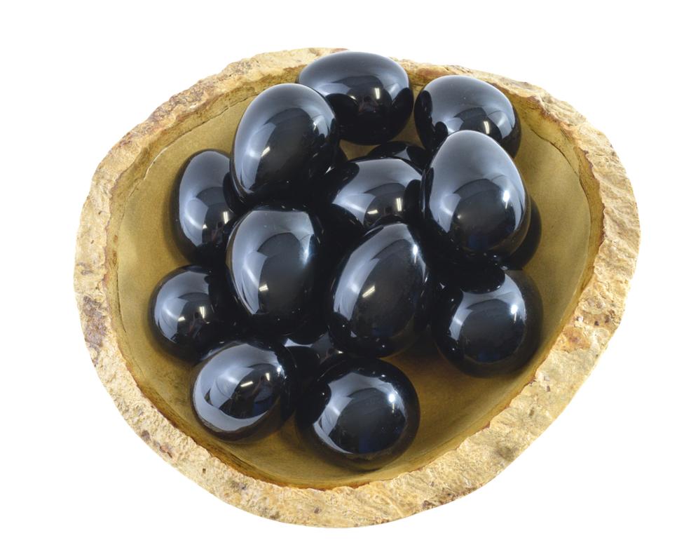 Group of polished black obsidian yoni eggs displayed together