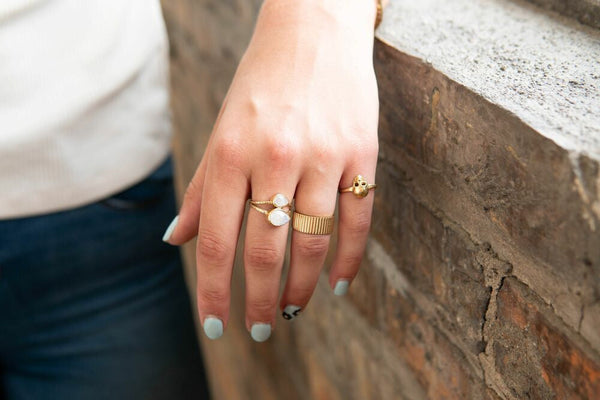 Close-up of recycled brass adjustable ring set with a genuine moonstone semi-precious stone, nickel-free