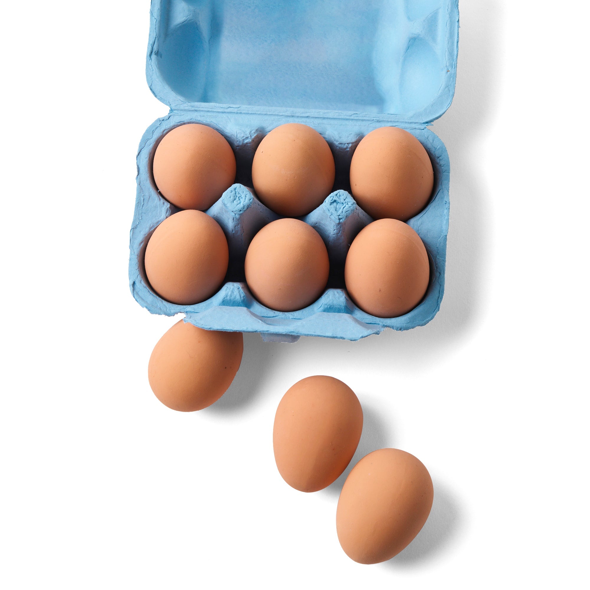 Open egg carton with bouncy rubber eggs and extra eggs displayed beside it by Elseware Unplug