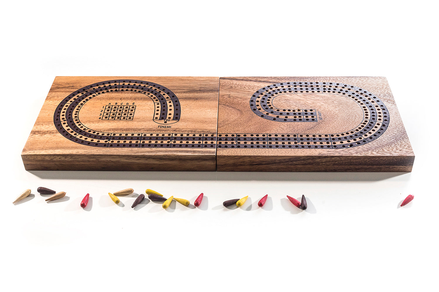Wooden cribbage board with pegs on a white background
