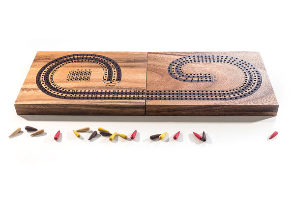 Wooden cribbage board with pegs on a white background