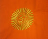 Embroidered symbol on orange fabric