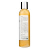 Woman applying organic caffeine hair growth mask to scalp for DHT blocking and strengthening treatment