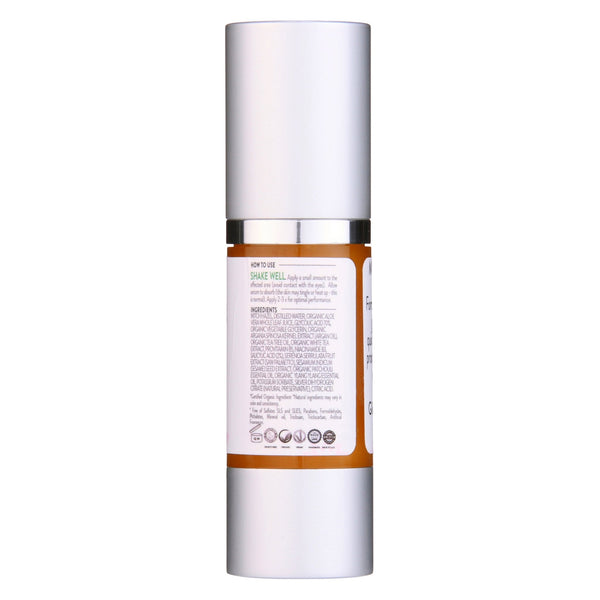 Glimmer Goddess organic acne serum displayed with botanical ingredients for clear skin