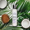 Organic body lotion with coconut milk displayed with natural ingredients including coconut and botanicals