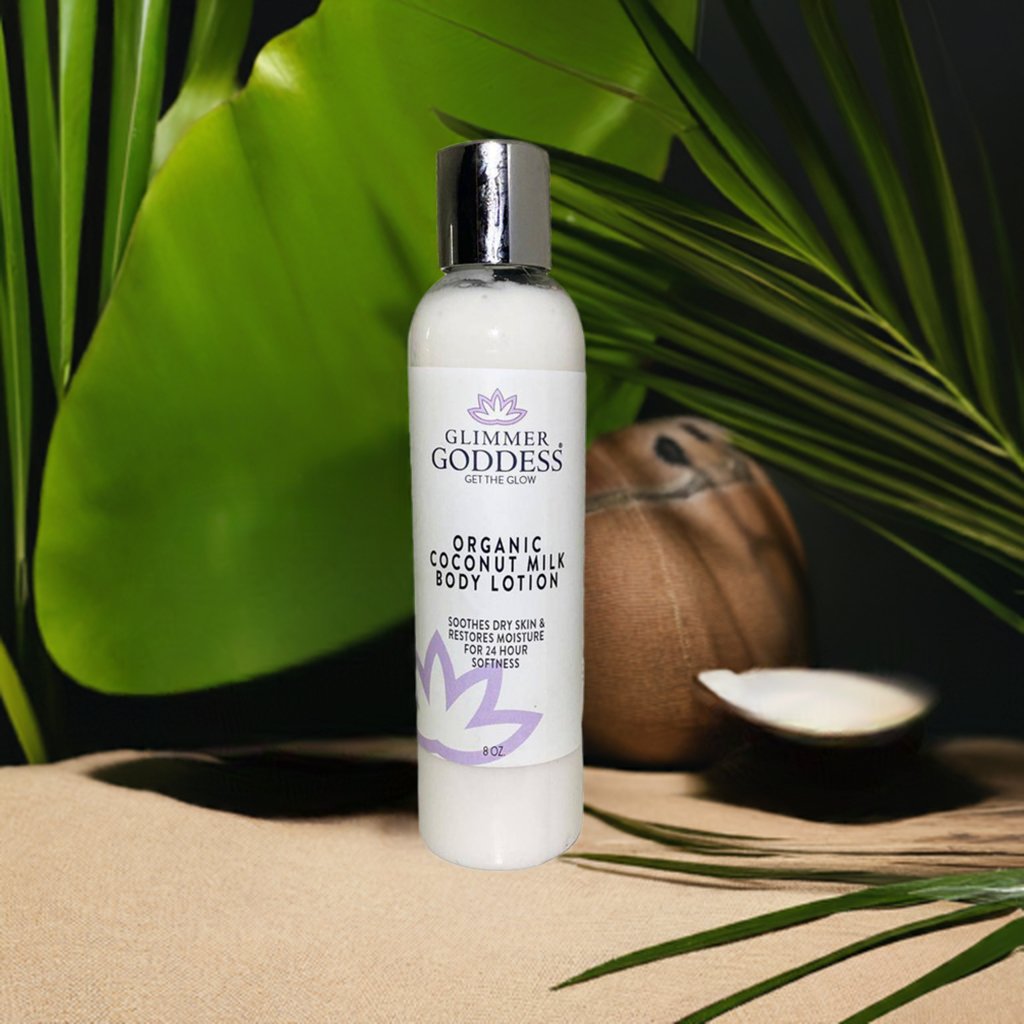 Glimmer Goddess organic coconut milk body lotion bottle with a coconut and leaves in the background