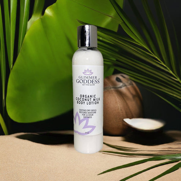 Glimmer Goddess organic coconut milk body lotion bottle with a coconut and leaves in the background