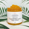 Glimmer Goddess organic pumpkin sugar scrub displayed with fall skincare flat lay styling