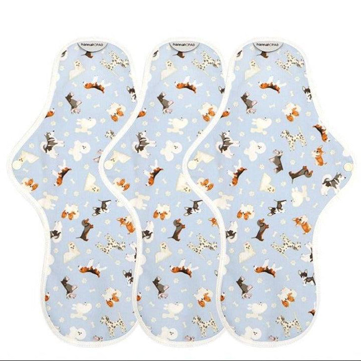 Three organic reusable overnight pads by The Brand hannah laid flat on a clean surface