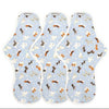 Three organic reusable overnight pads by The Brand hannah laid flat on a clean surface
