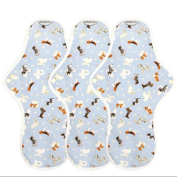 Three organic reusable overnight pads by The Brand hannah laid flat on a clean surface
