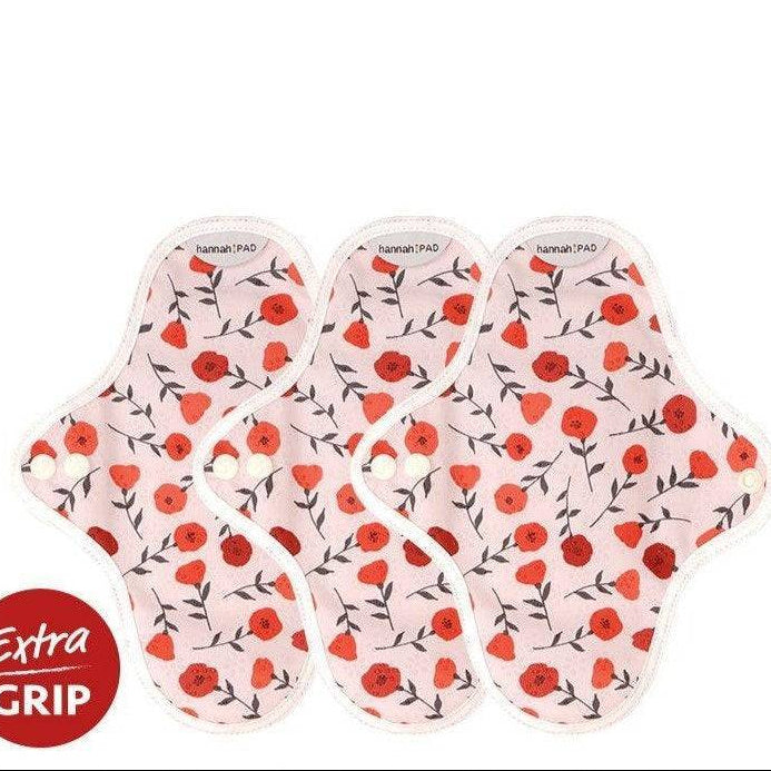 Hannah organic reusable pantyliners 3-pack laid out showing variety of prints and snap closures
