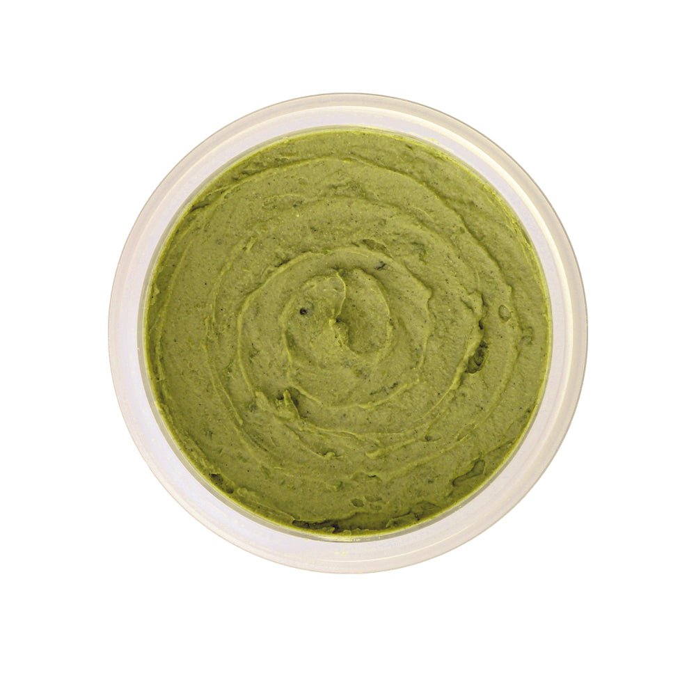 Woman applying organic seaweed and bentonite clay face mask to clear skin and reduce breakouts