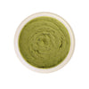 Woman applying organic seaweed and bentonite clay face mask to clear skin and reduce breakouts