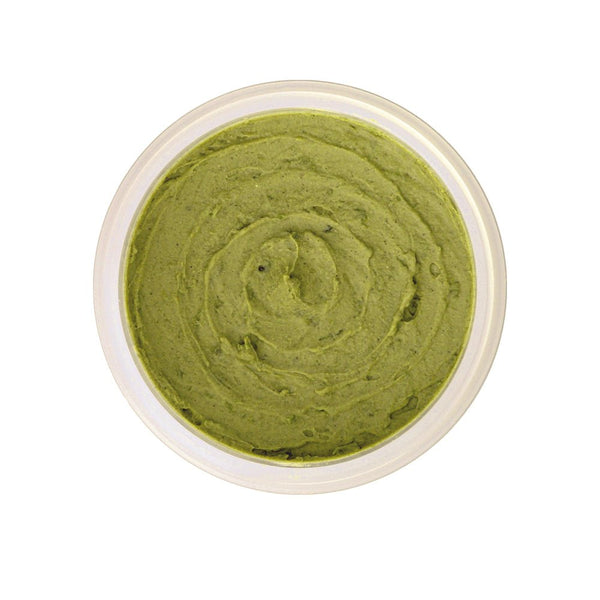 Woman applying organic seaweed and bentonite clay face mask to clear skin and reduce breakouts
