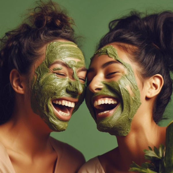 Two women with green face masks on a green background