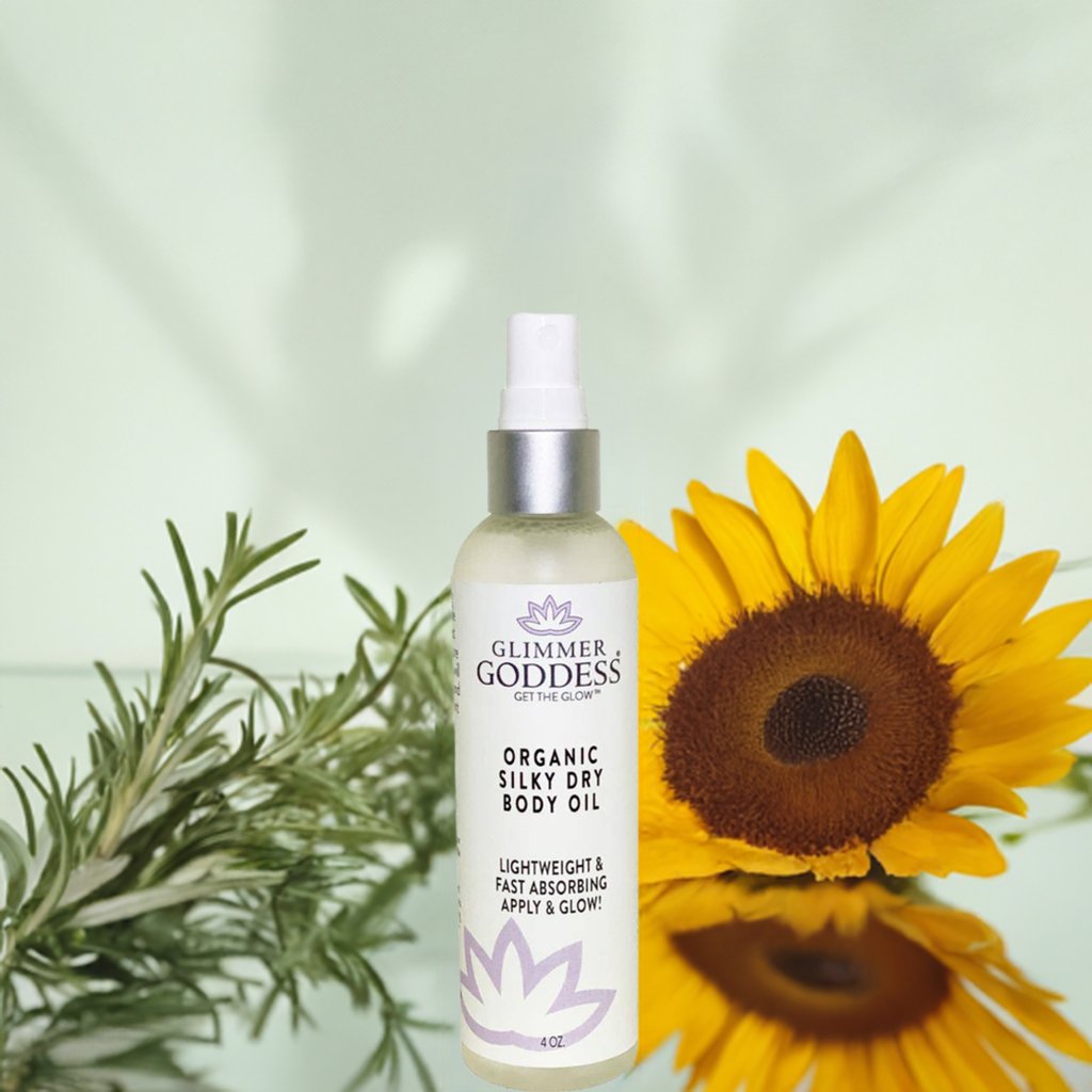 Close-up of Glimmer Goddess Organic Dry Body Oil 4 oz bottle showing product label detail
